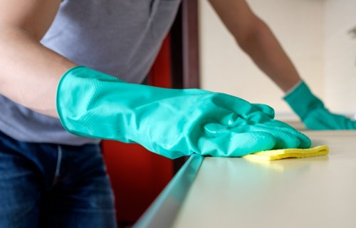 A local specialist handling curtain fabrics with care